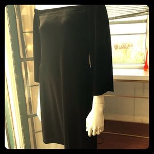 Black velvet off the shoulder cocktail dress.